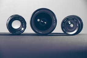 Black and white photo with the beautiful camera lenses with reflections