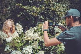 photo session in the thickets of a blooming garden