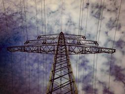 high-voltage tower against a cloudy sky