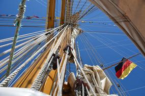 german flag on the ropes of a sailboat