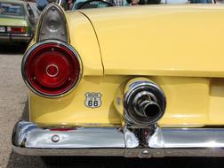 red spotlight of yellow retro Vehicle