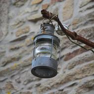 Lamp on branch and wall