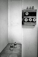 Black and white photo of the fuse box on the wall