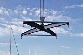 photo of a boat crane in the port