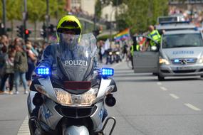 a police officer on a motorcycle on a street in Hamburg