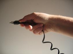 cable plug in hand