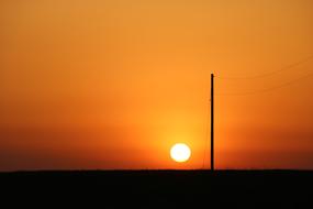 pillar on the background of the golden dawn