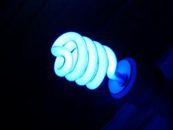 Light Blue fluorescent lamp in the dark