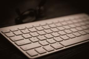 white computer keyboard on the table