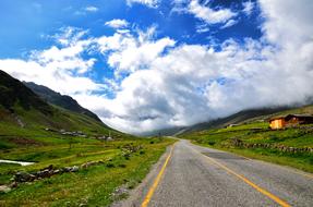 empty road through scenic countryside at summer