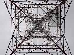 bottom view of Transmission Tower and grey sky