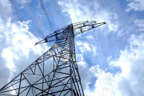 Electric Pylon Current and cloudy blue sky