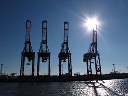 Port Cranes and sun