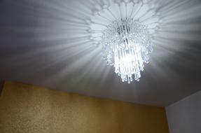 light of crystal chandelier in the room