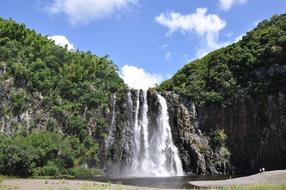 photo of a tropical waterfall