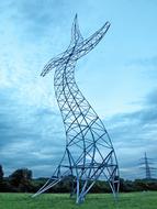 curved high tower on a green field