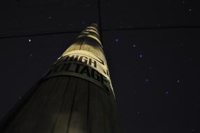 photo of an electric pole on a background of the starry sky