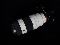 photo of black and white professional sony camera on black background