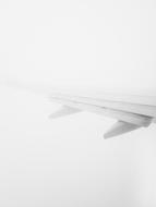 Wing of the airplane in fog