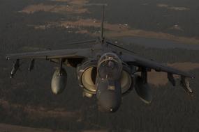 photo of attack aircraft McDonnell Douglas AV-8B Harrier II high in the sky