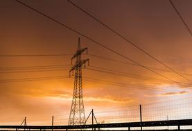 Current Electricity Strommast and orange sky