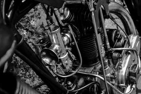 Motorcycle Carburetor in black and white background close up