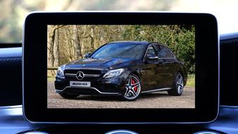 photo of luxury mercedes on tablet screen