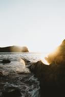 Beautiful, rocky shore of the ocean, at colorful sunset