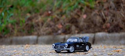 model of a vintage car mercedes on the road