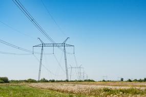 Beautiful landscape with the colorful fields and power lines, at blue sky on background, in Uzhgrorod, Ukrane, in summer