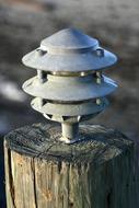 Close-up of the shiny beach light on the wood, in light