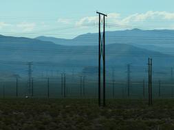 Lines Electricity over a mountain landscape at dusk
