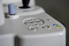 Close-up of a white device with colorful buttons