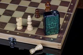 electronic cigarette on a chessboard