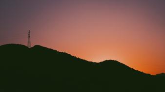 utility poles at sunset