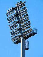 Lamps on the spotlight of the stadium at blue sky