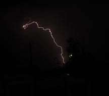 Orange lightning in the sky, at night