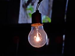 light bulb on a wire in the dark