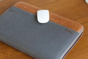 wireless computer mouse lies on a macbook