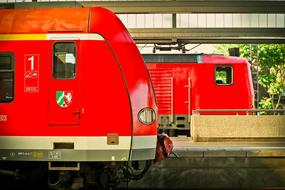 red steam locomotive at the railway station