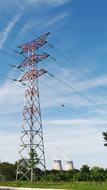 High Voltage Post Pylon in the middle of nature on a sunny day