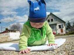 kid on a pebble surface close up