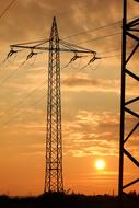 high voltage pylons at sunset