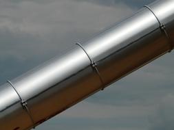 Close-up of the metal, iron tube in light