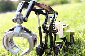Toy Backhoe Crane Green grass