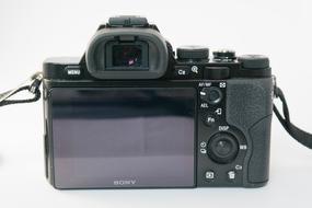 Beautiful, black Sony Alpha 7 camera, at white background