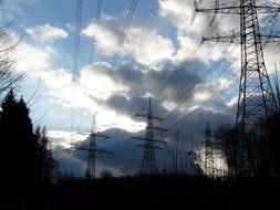 electric poles, forest, clouds