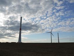 Beautiful landscape of the field with pinwheels, at blue sky with clouds in the evening in Palatinate, Germany