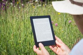 photo of an e-book in a woman's hands