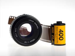 Close-up of the 35mm celluloid film, with reflection on the white surface, clipart